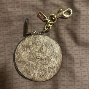 Coach Signature Canvas Circular Coin Pouch bag charm in the color khaki brown